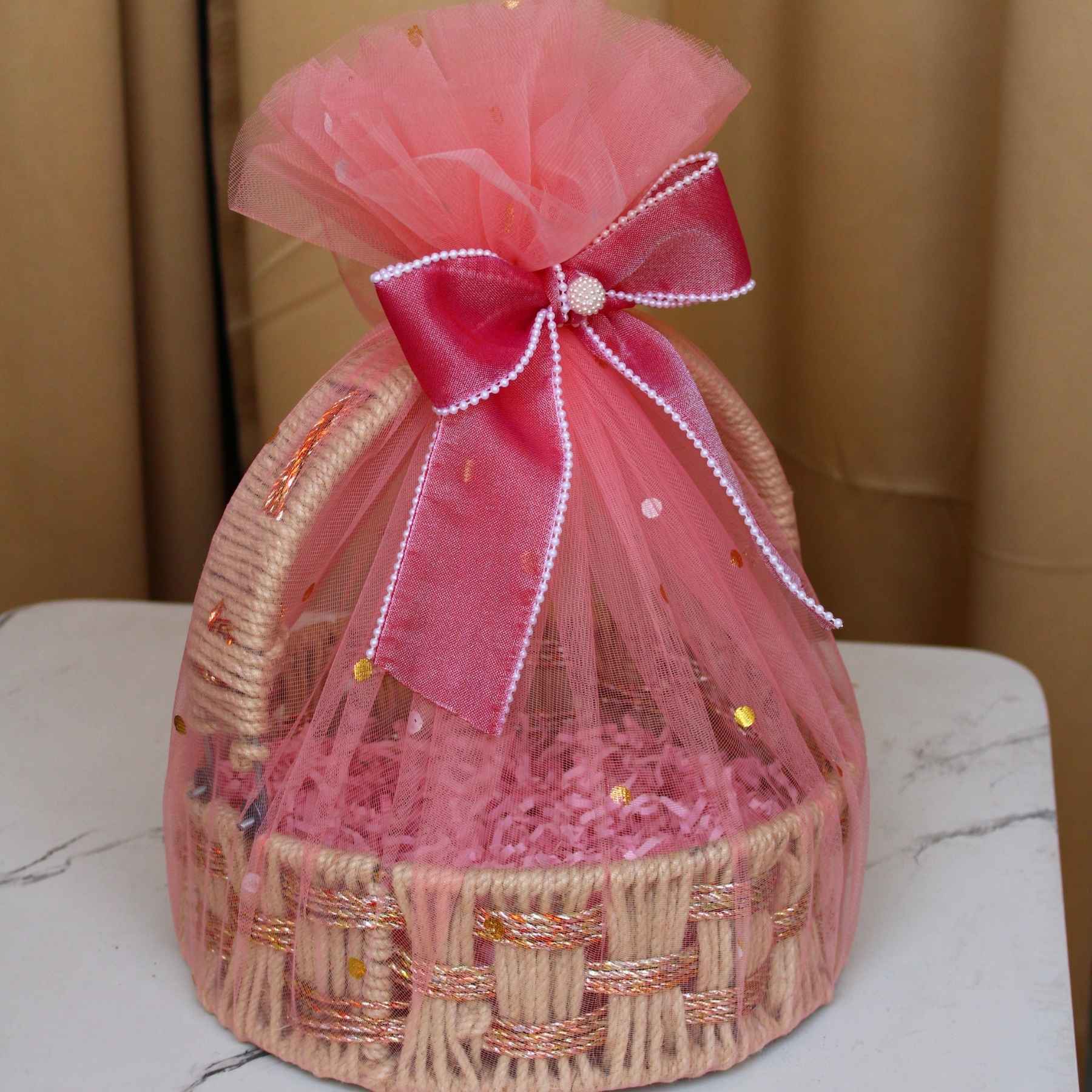 Ready to use jute handle hamper basket with pink premium net and bow — handle vs open vs tray basket style guide by Adscraft