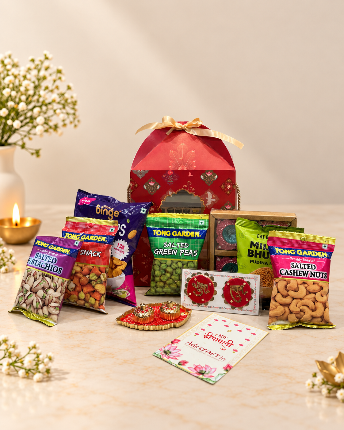 Royal Red Festive Diwali hamper with premium snacks, dry fruits, decorative diyas and Shubh-Labh accents