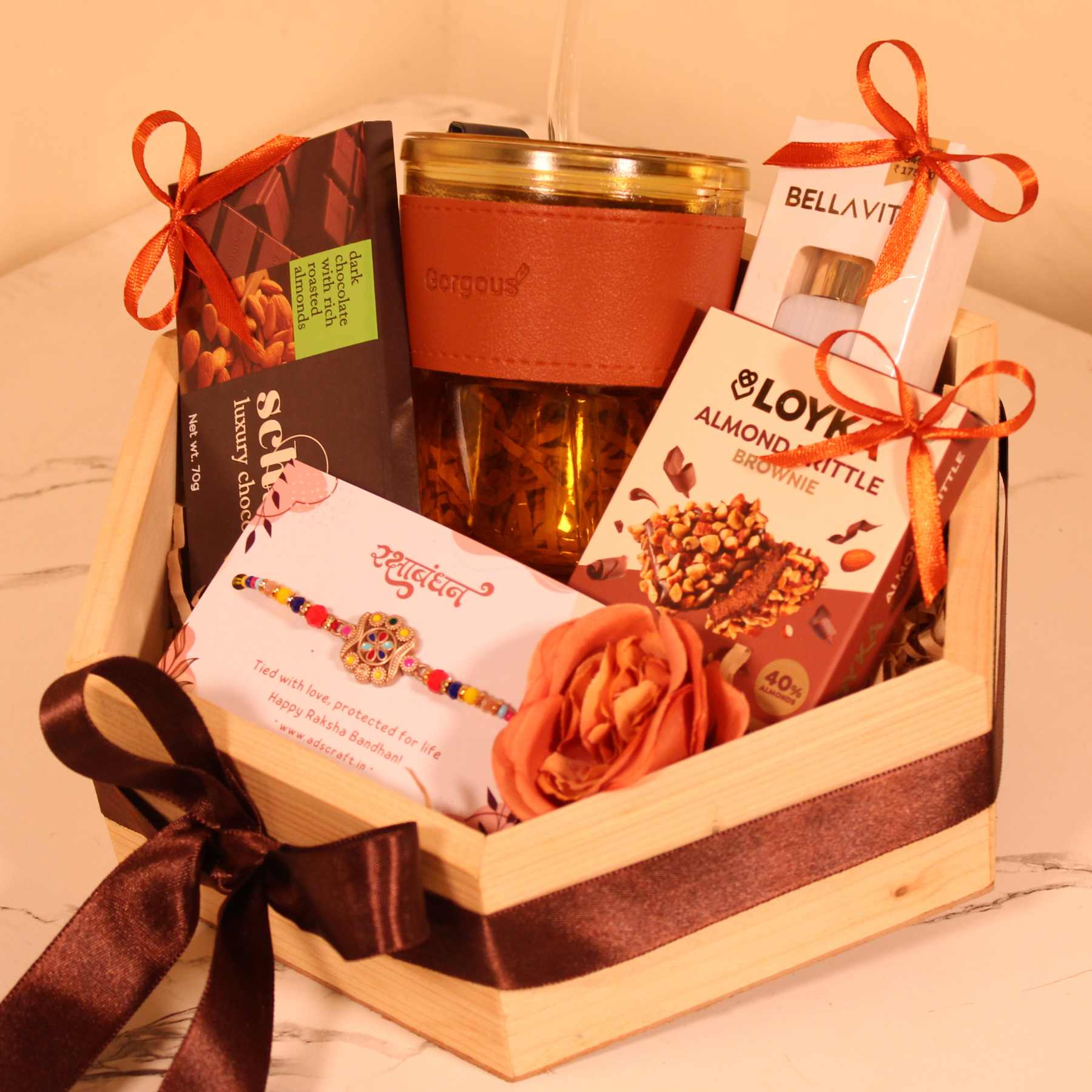 Wooden basket Rakhi gift set for brother featuring Bella Vita perfume, chocolates, and custom greeting card.