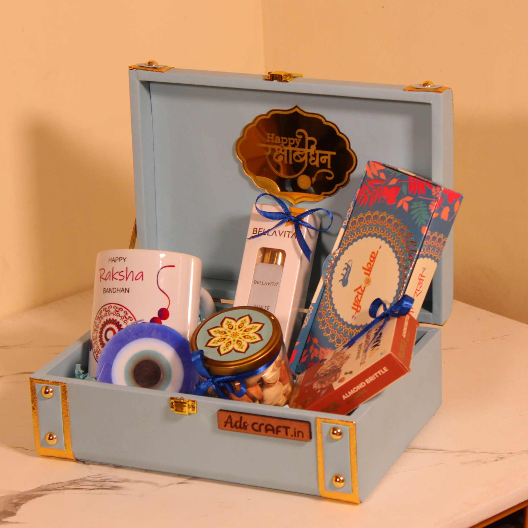 Luxury Rakhi Gift Hamper for Him – Blue Trunk Box with Mug, Perfume, Premium Rakhi & Scented Candle