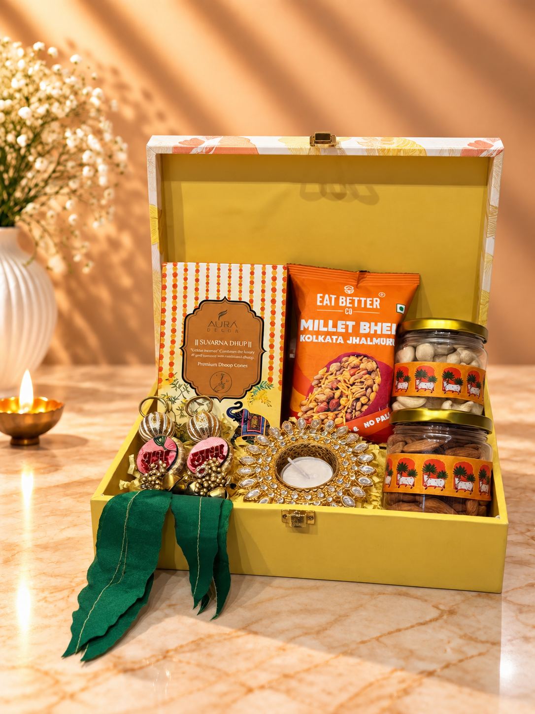 Yellow Diwali trunk hamper with cashews, almonds, dhoop sticks, premium diya, Shubh Labh and festive decor