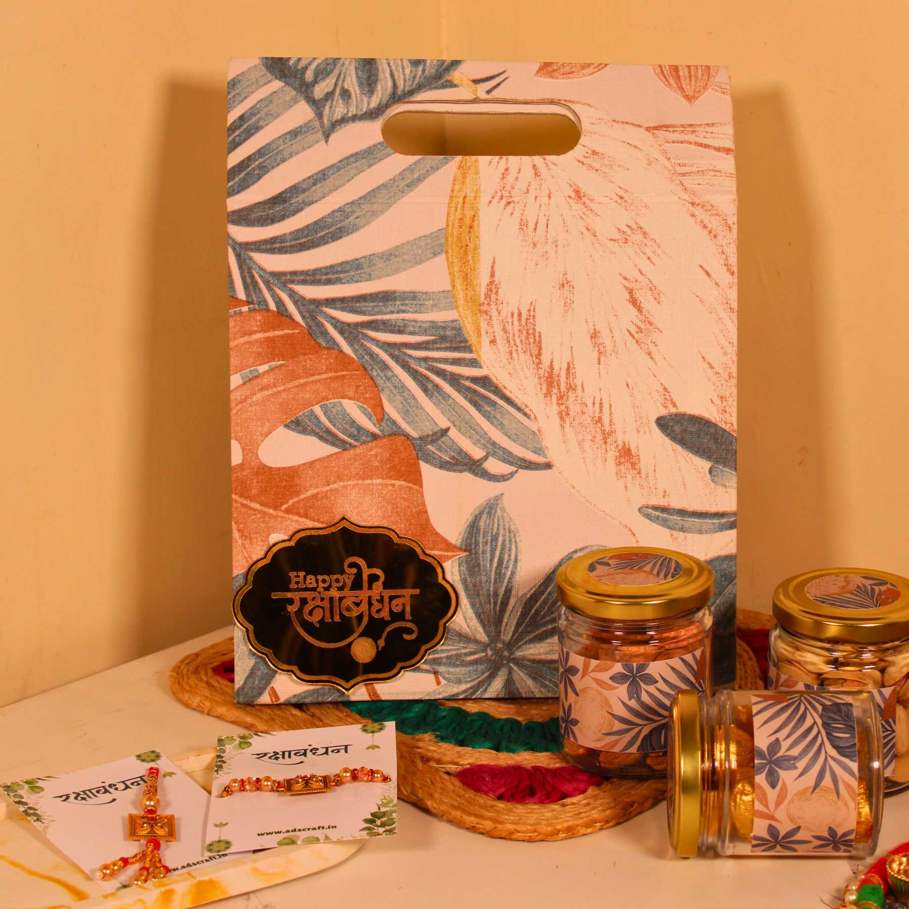 Aesthetic Rakhi hamper for Bhaiya Bhabhi in canvas bag with dry fruits and couple rakhi.