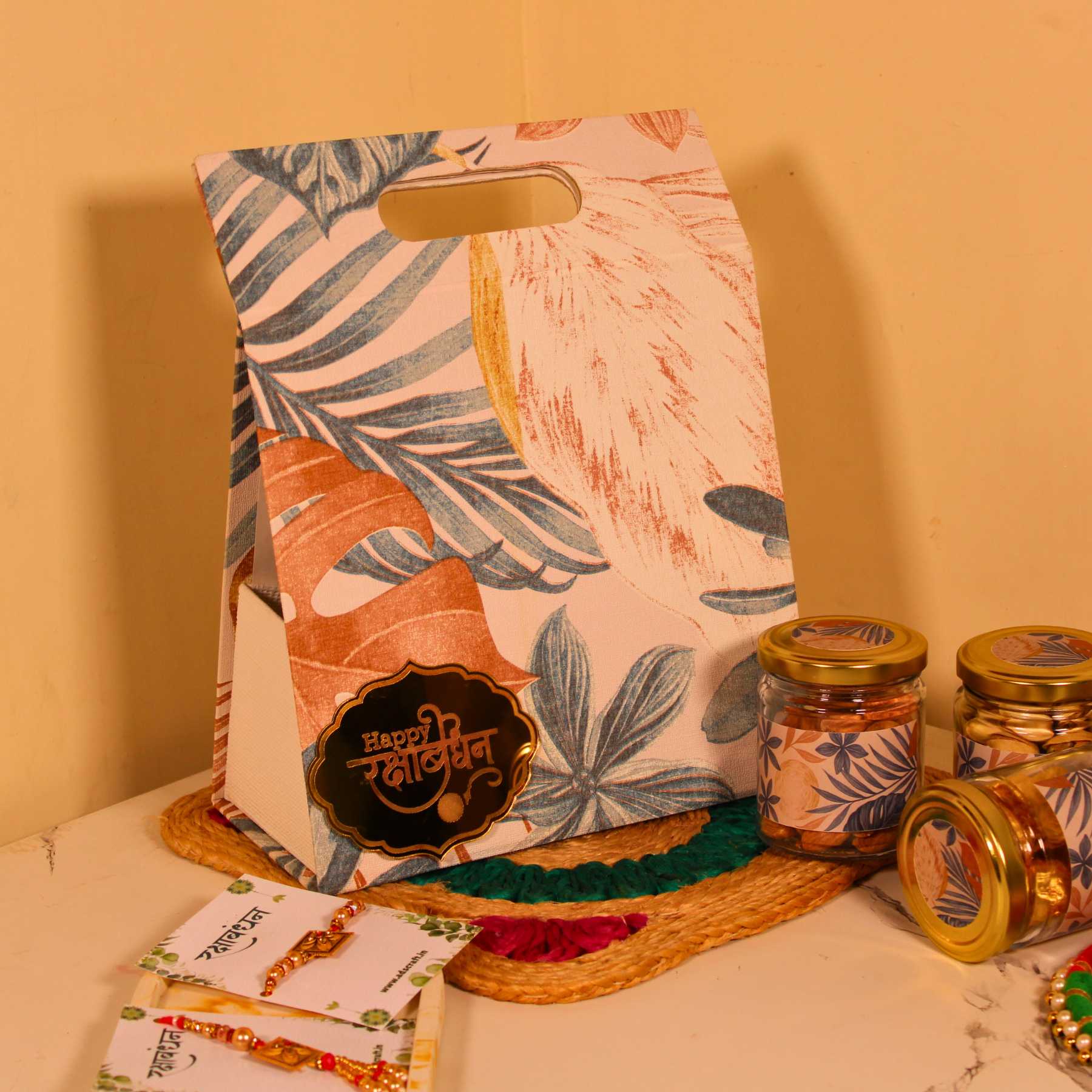 Aesthetic Rakhi hamper for Bhaiya Bhabhi in canvas bag with dry fruits and couple rakhi.