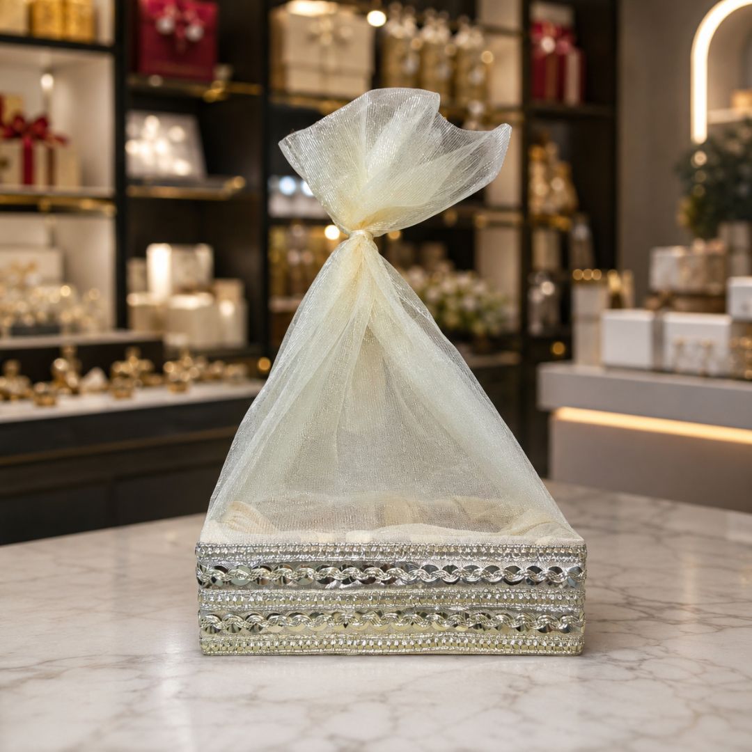 Set of 3 cream potli baskets arranged side by side, ideal for uniform wedding return gift hampers