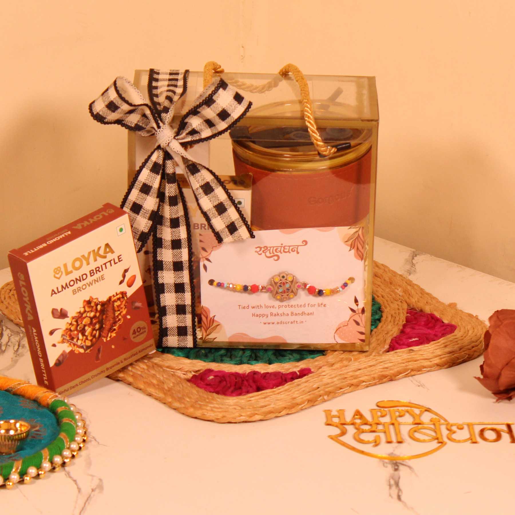 Rakhi Gift Hamper for Him – Premium PVC Bag with Perfume, Coffee Sipper, Rakhi & Almond Brittle