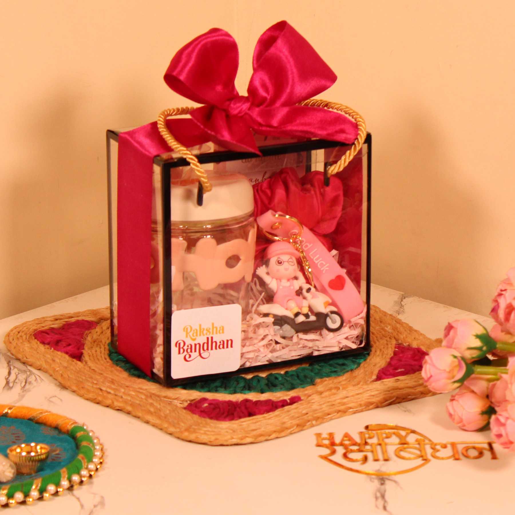 Rakhi Gift Hamper for Her – Pink Box with Sipper, Chocolate, Keychain & Scrunchie
