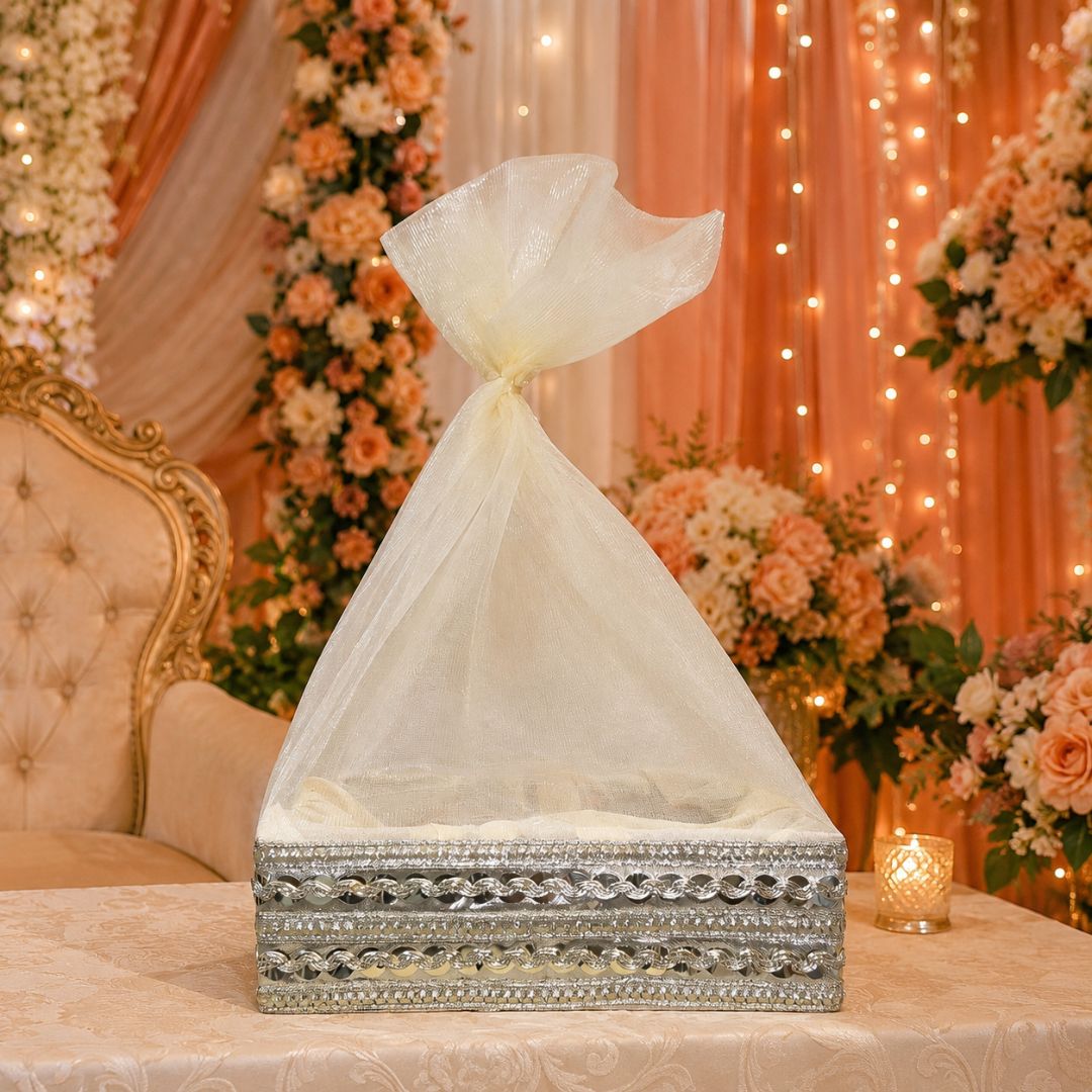 Cream organza potli basket angled view showing square 8x8 inch base and drawstring potli top