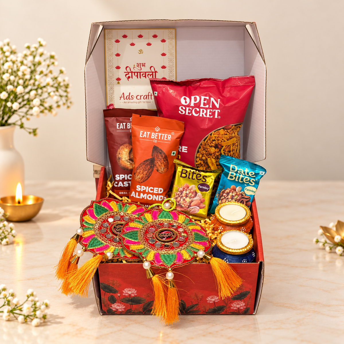 Open Floral Festive Diwali hamper with Eat Better spiced dry fruits, Open Secret namkeen, Farmley date bites and festive decor