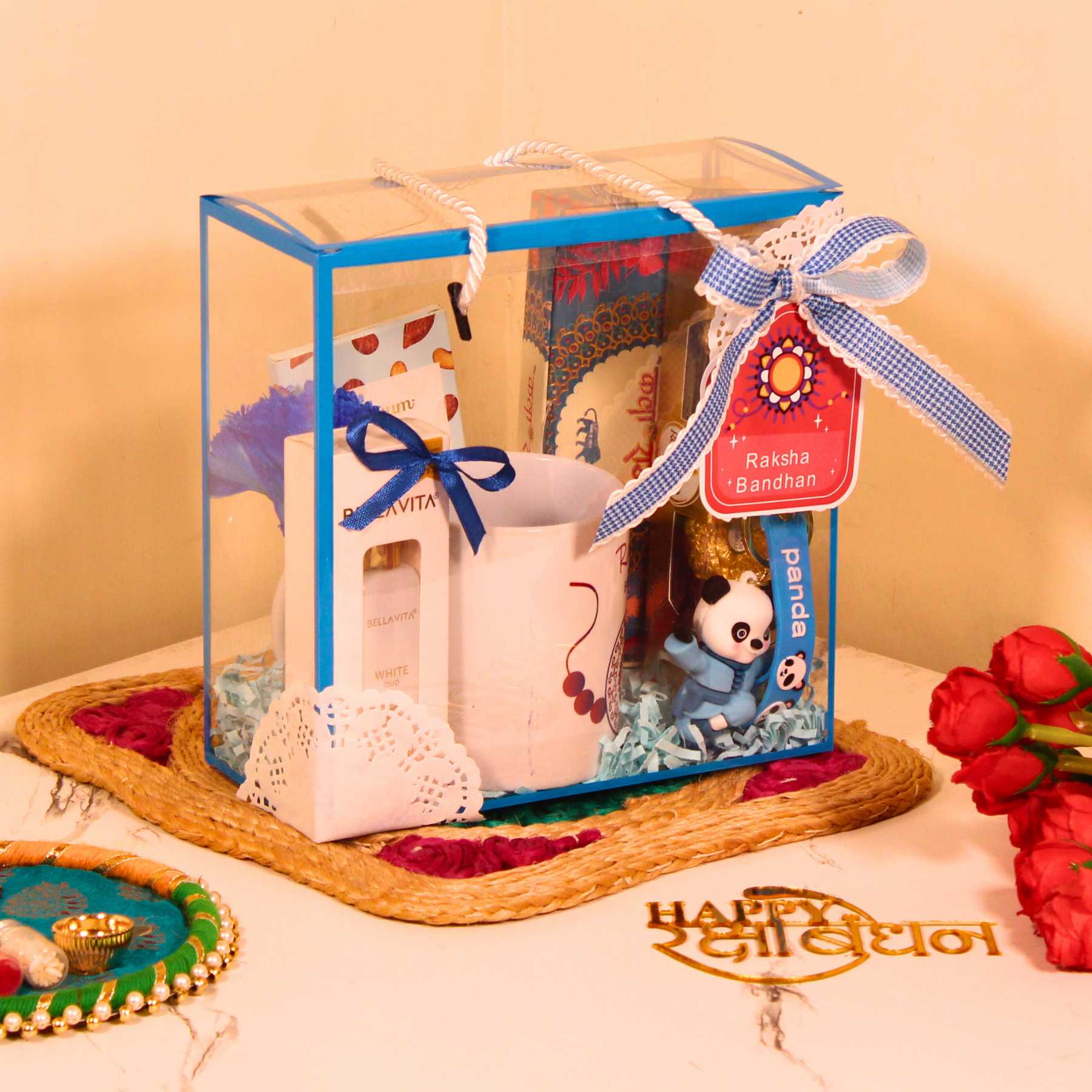 Rakhi Gift Hamper for Brother – Blue PVC Bag with Mug, Perfume, Chocolates & Keychain