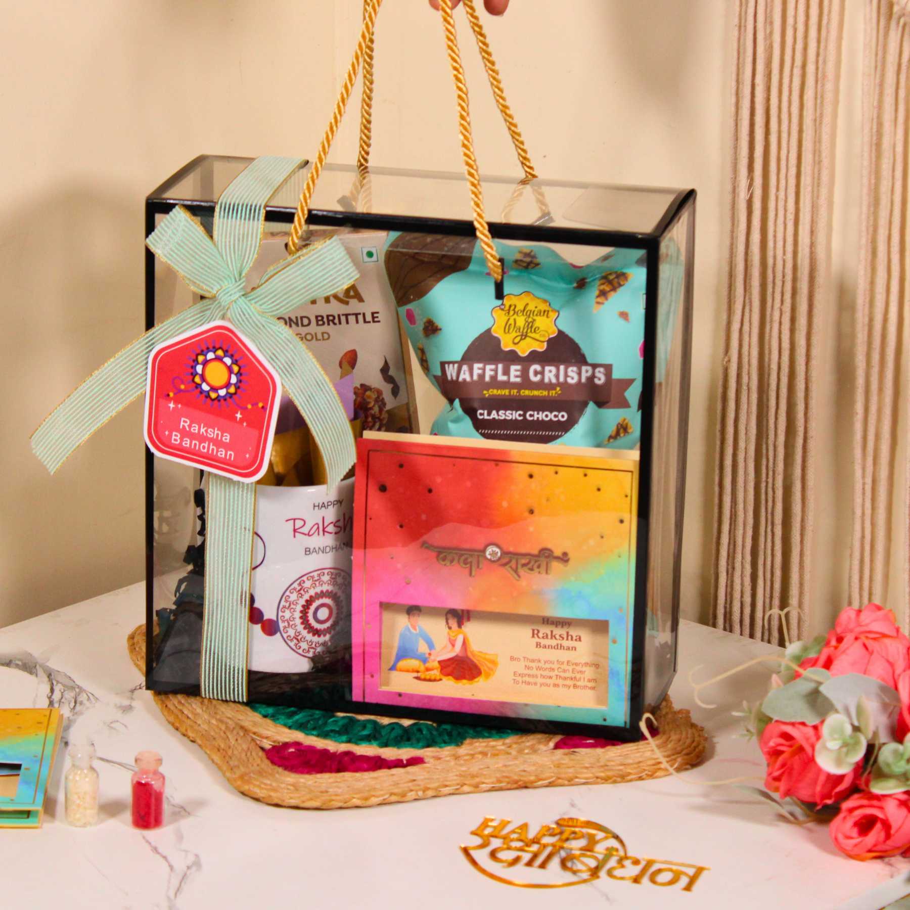 Rakhi Gift Hamper for Brother – PVC Bag with Waffle Crisps, Brittle, Mug & Rakhi