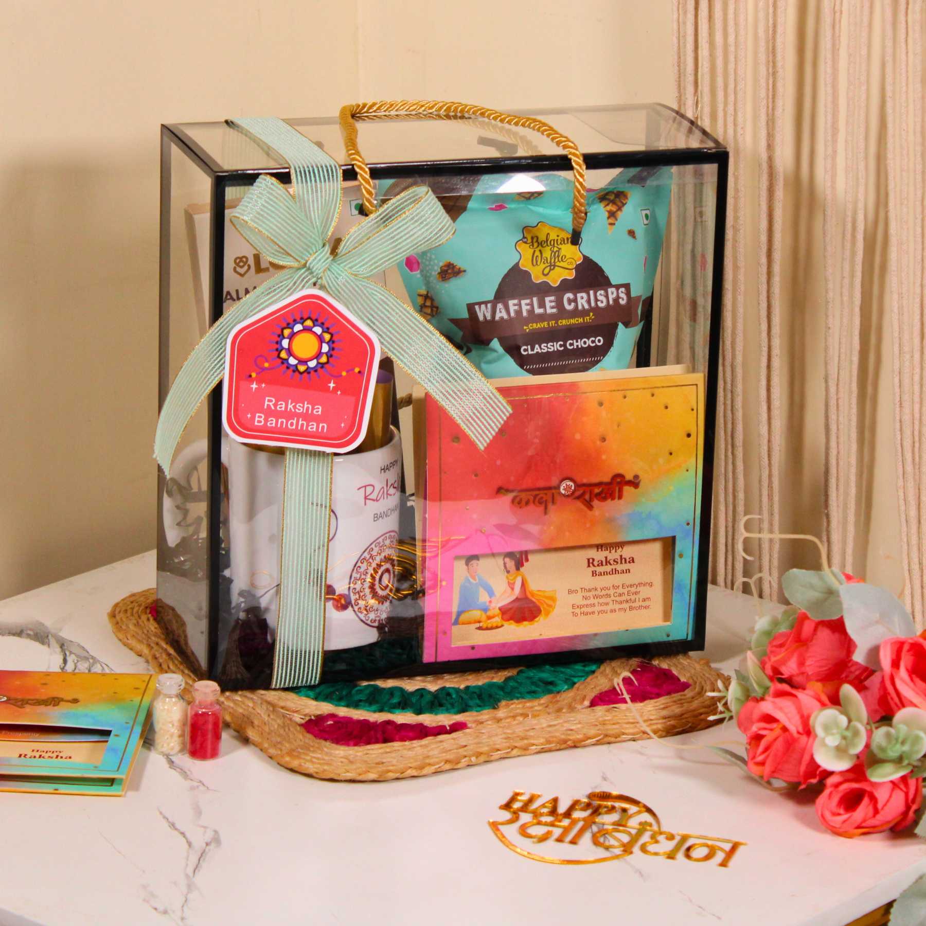 Rakhi Gift Hamper for Brother – PVC Bag with Waffle Crisps, Brittle, Mug & Rakhi