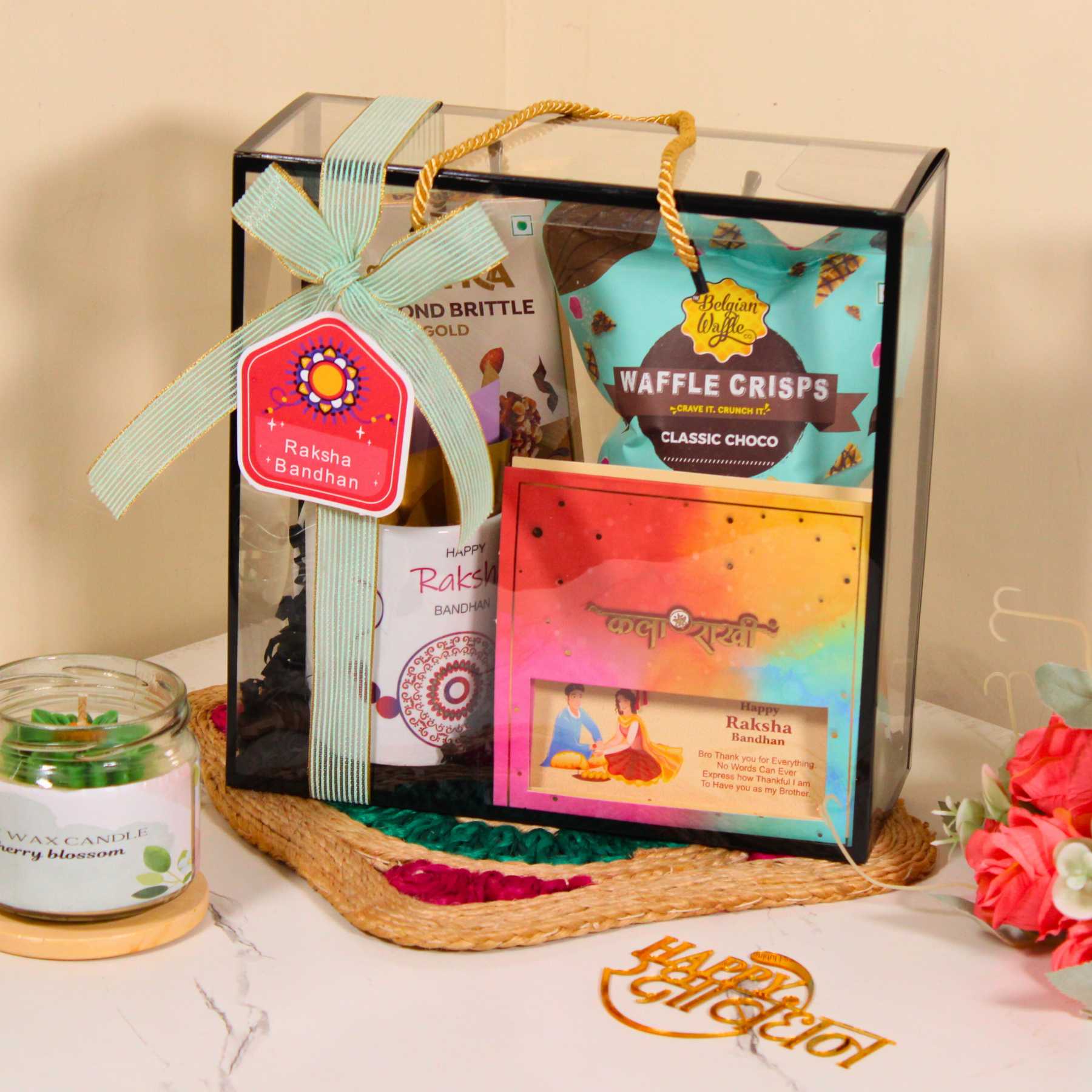 Rakhi Gift Hamper for Brother – PVC Bag with Waffle Crisps, Brittle, Mug & Rakhi