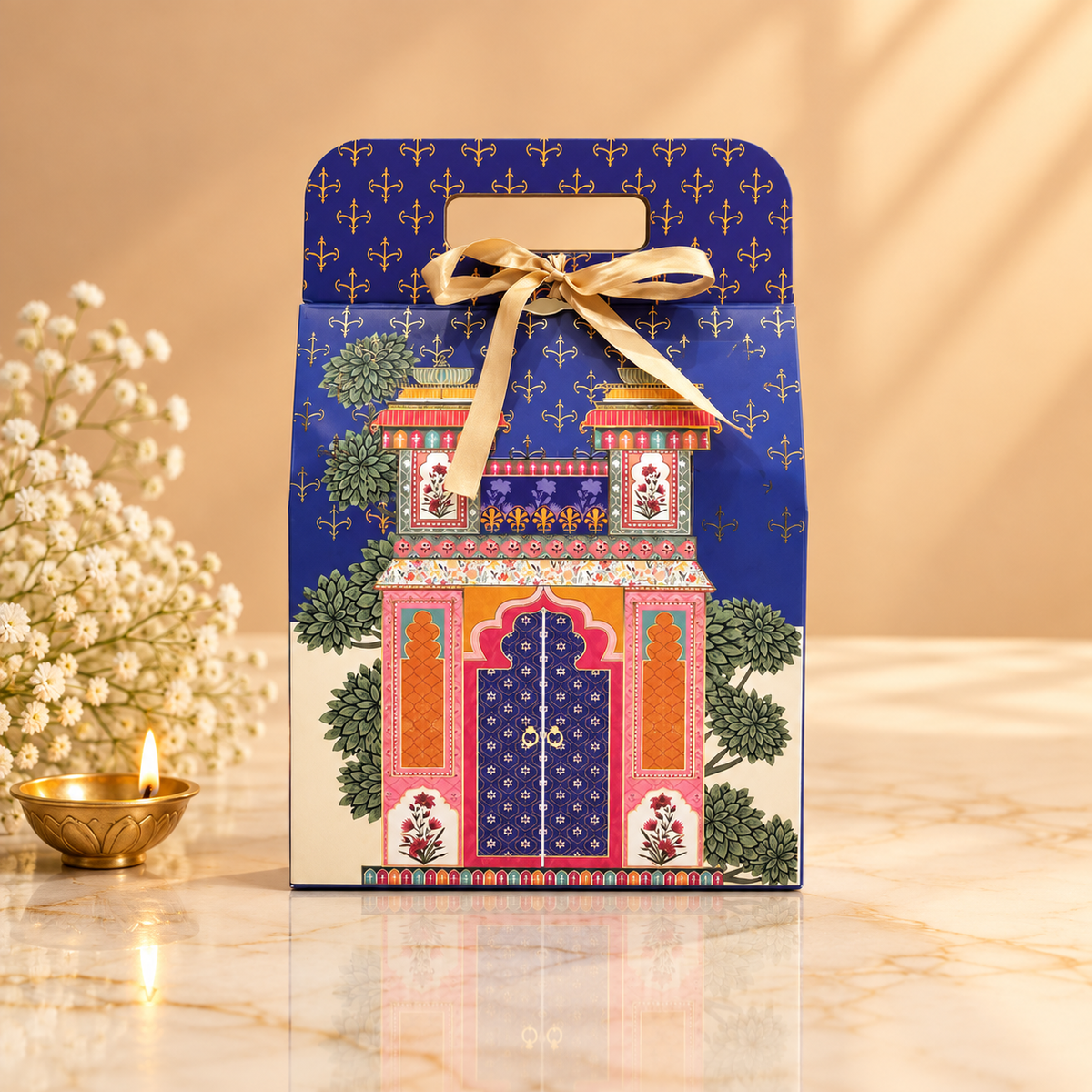 Royal Blue Heritage Diwali hamper with premium snacks, almond brittle, clay diyas and decorative toran