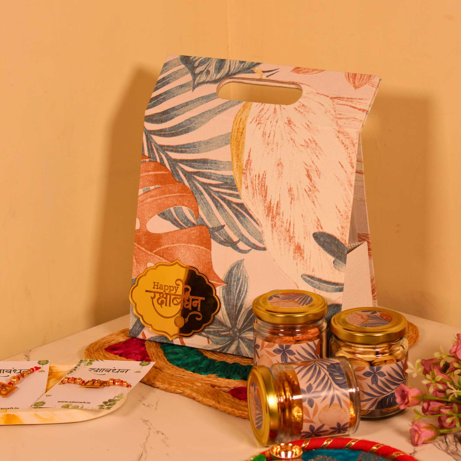 Aesthetic Rakhi hamper for Bhaiya Bhabhi in canvas bag with dry fruits and couple rakhi.