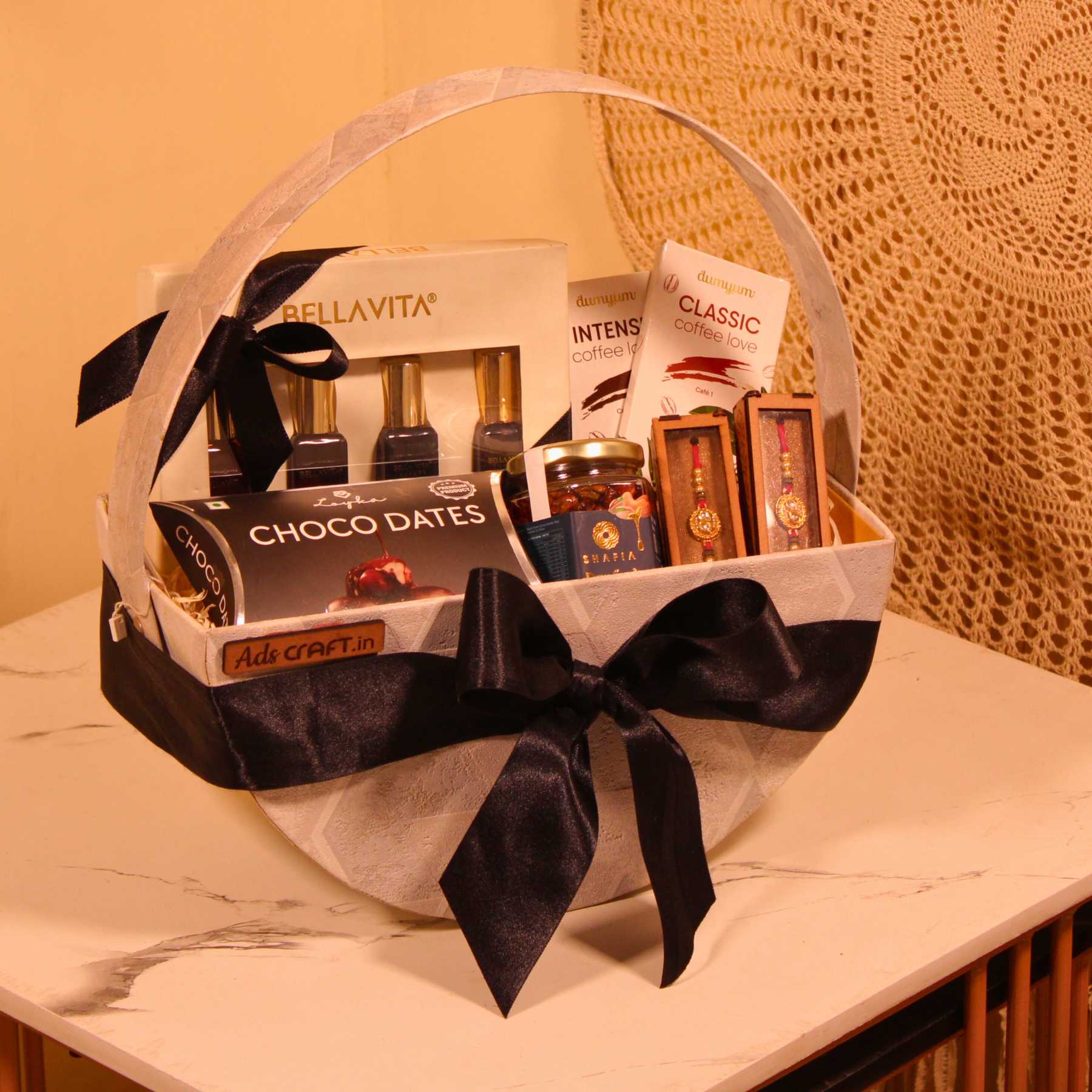 Exclusive Raksha Bandhan gift hamper for couples with Bellavita perfume, Loyka choco dates, and Dumyum chocolate bars.
