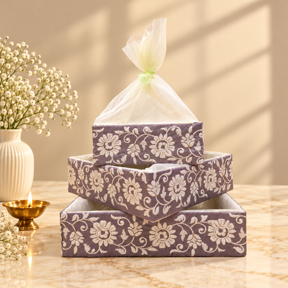 Lavender Jacquard nesting tray set of 3 with white floral embroidery and ivory sheer net cover for wedding and festive gifting in India