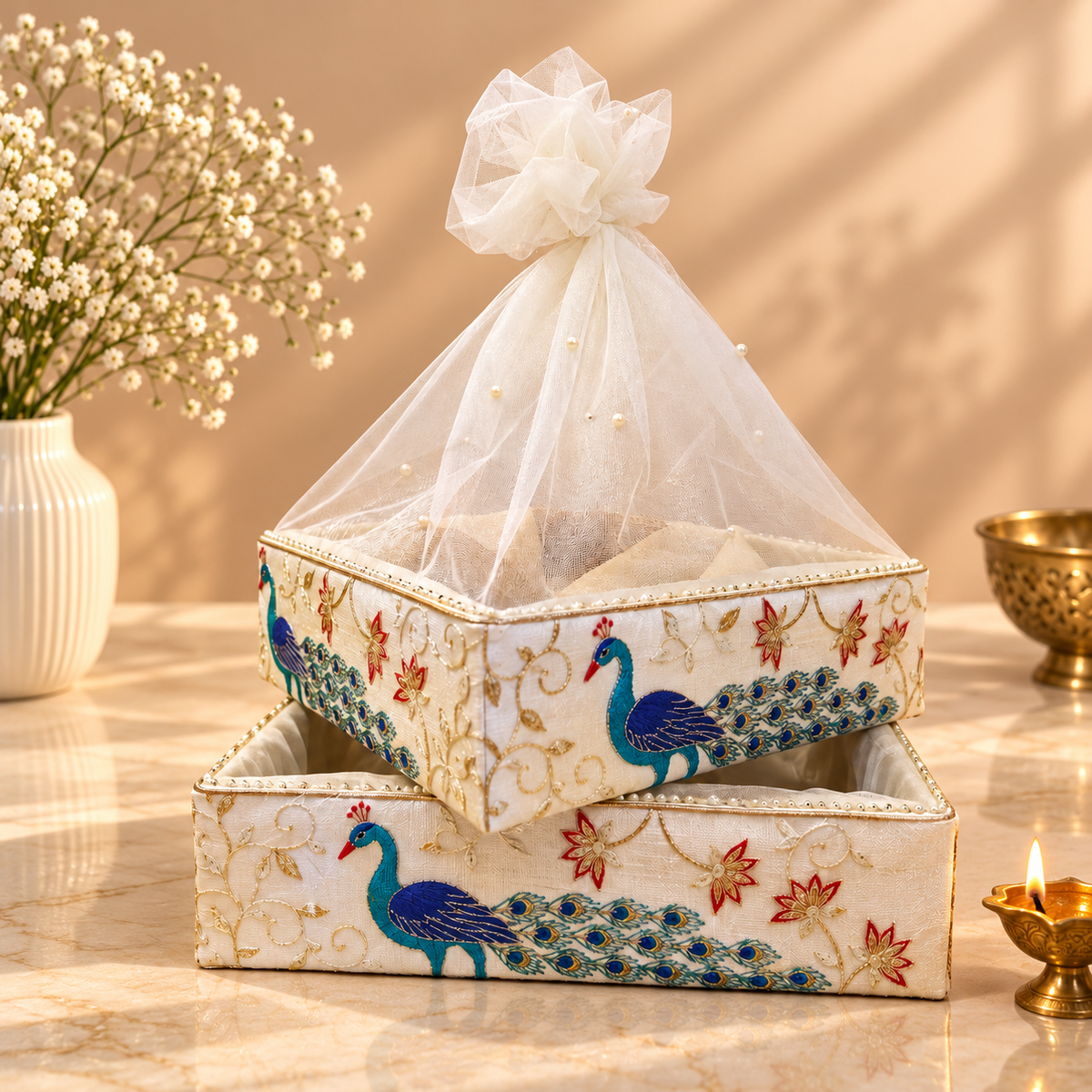 Royal Peacock and Floral Motif nesting tray set of 2 with pearl beaded border and pearl-studded net cover for festive gifting in India