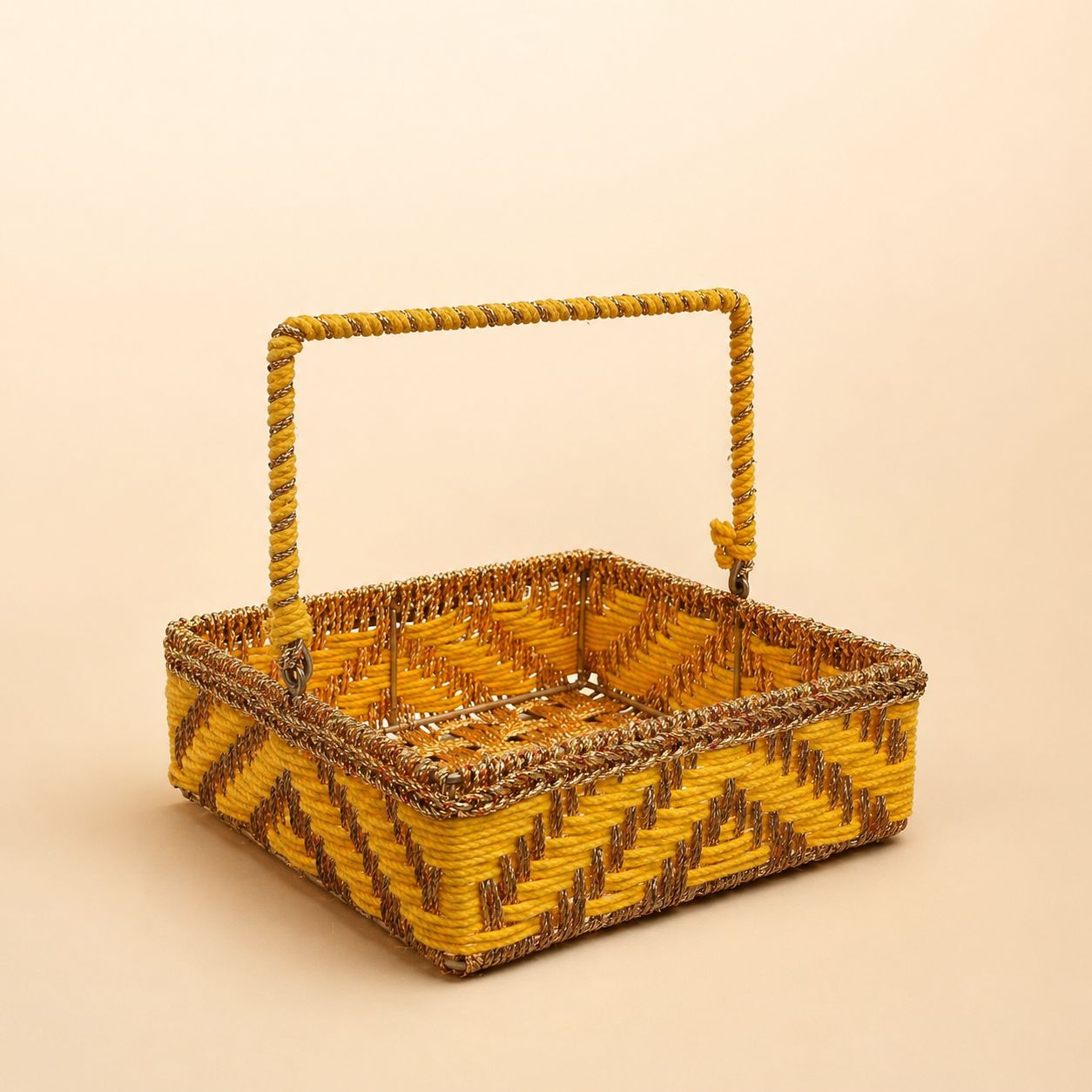 Woven basket with a handle on a beige background