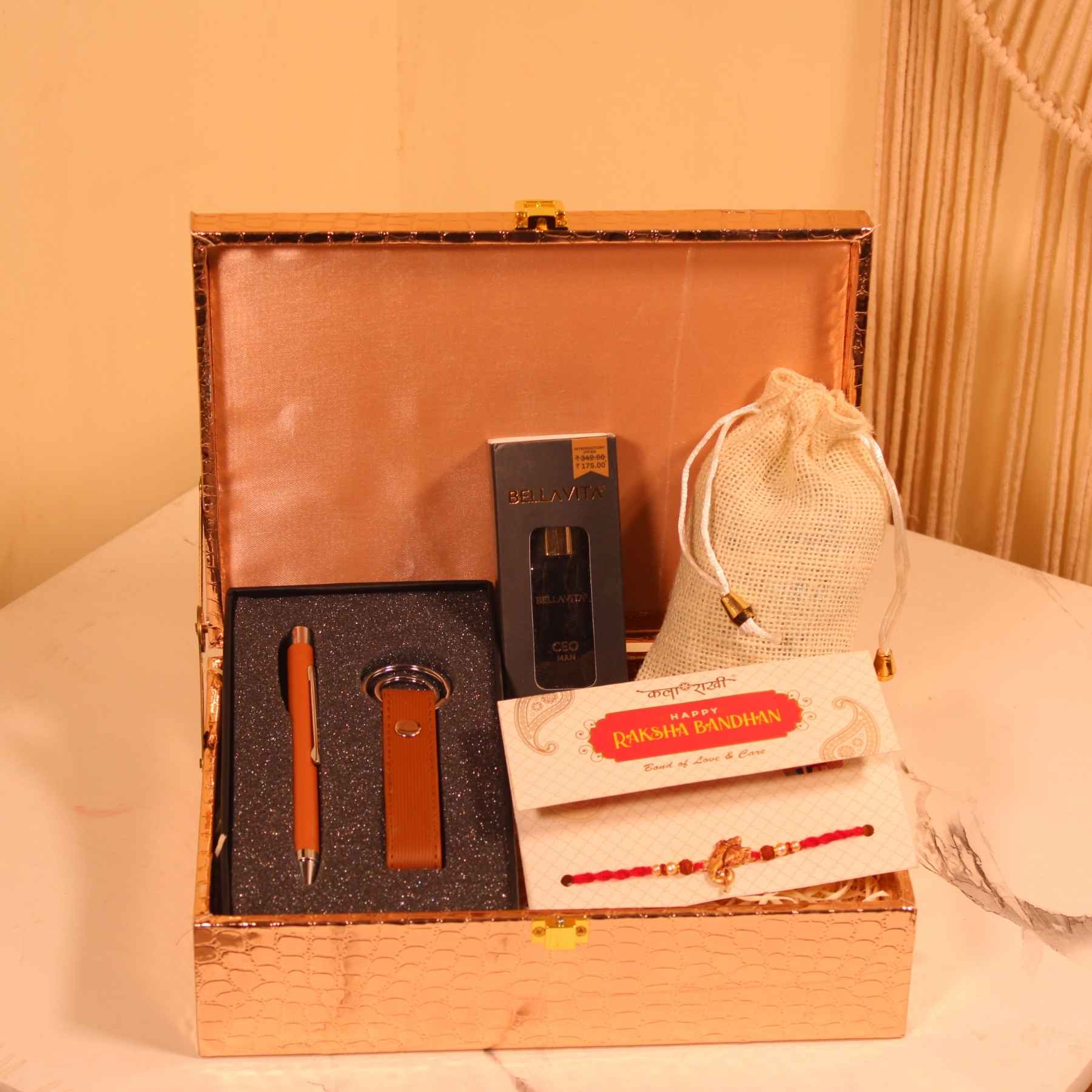 Golden Elite Rakhi Box – Perfume, Chocolate & Pen Set Hamper for Him
