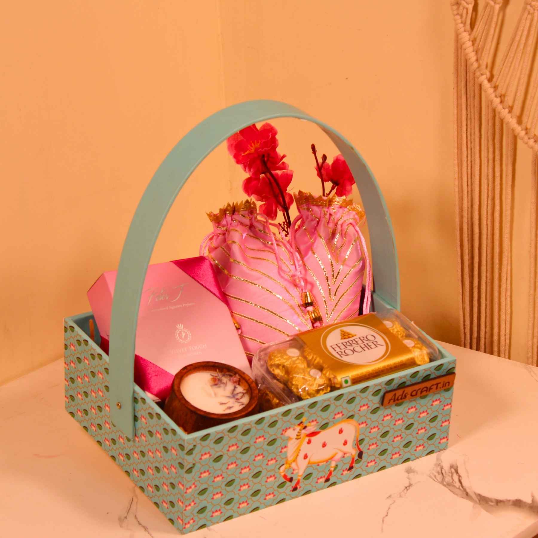 Pastel Glow Rakhi Hamper – Perfume, Chocolates & Potli Treats in Designer Basket
