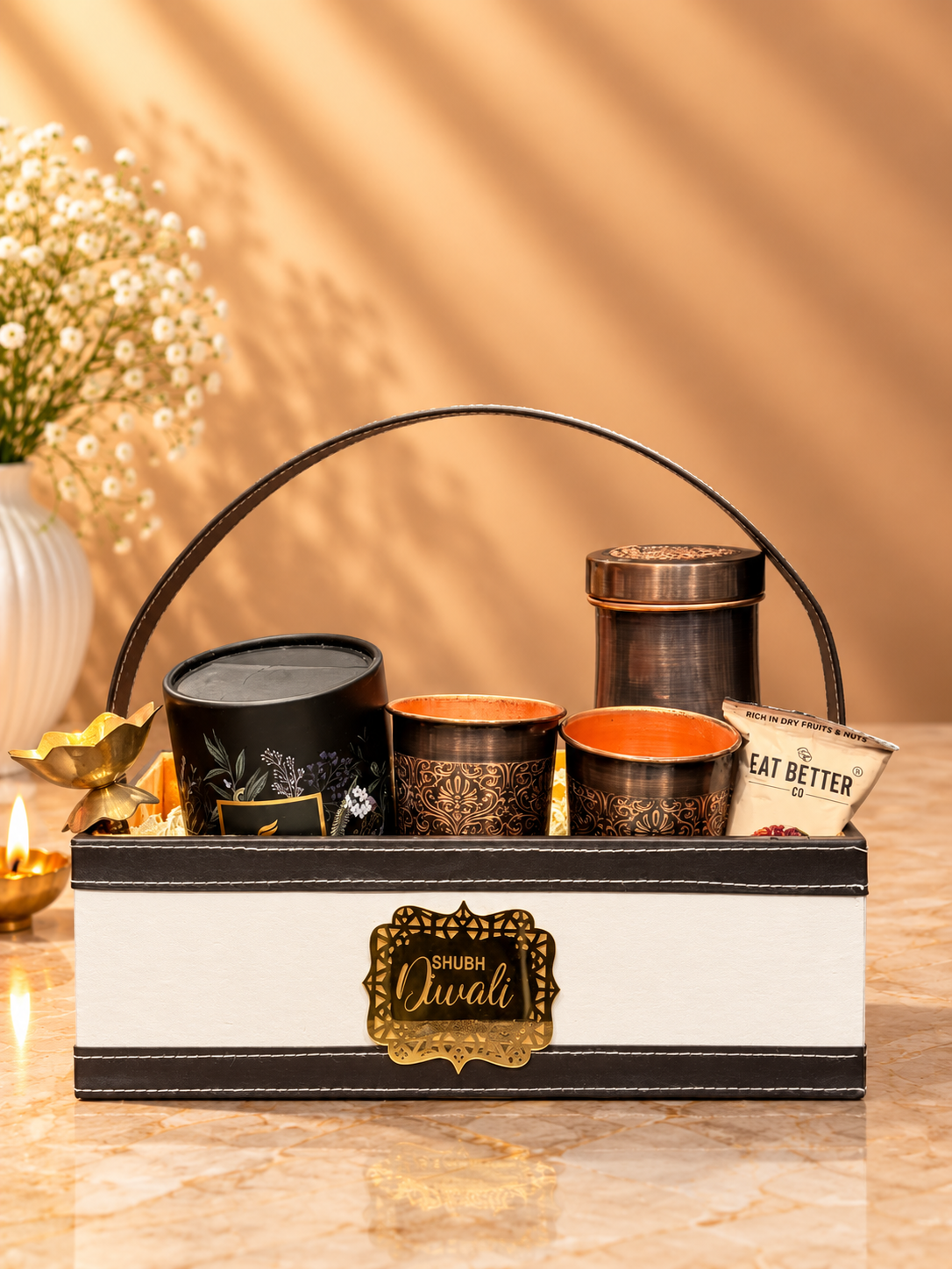 Heritage Luxe Diwali hamper with brass pot and glass set, brass diya, candle and premium festive treats